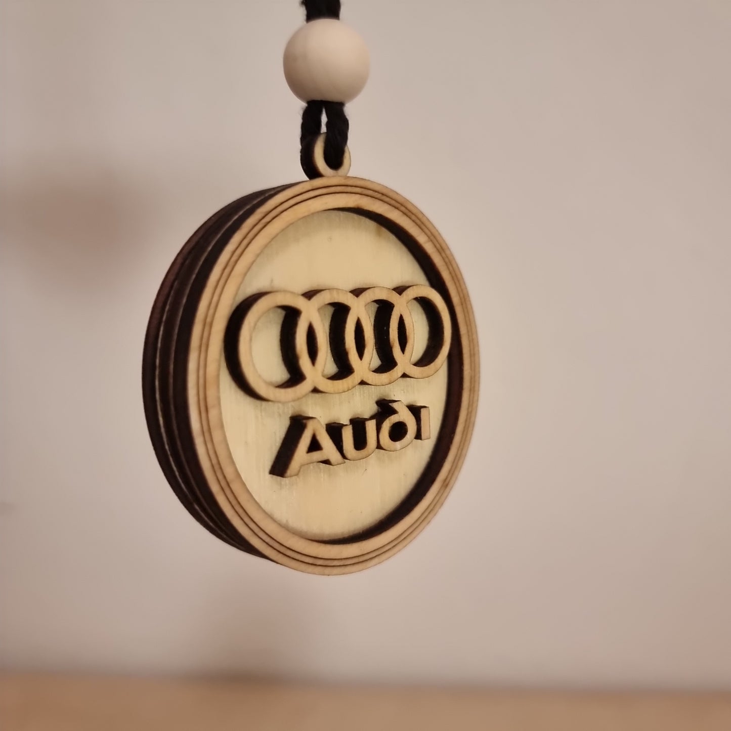 Audi pendant in wood with 3D effect