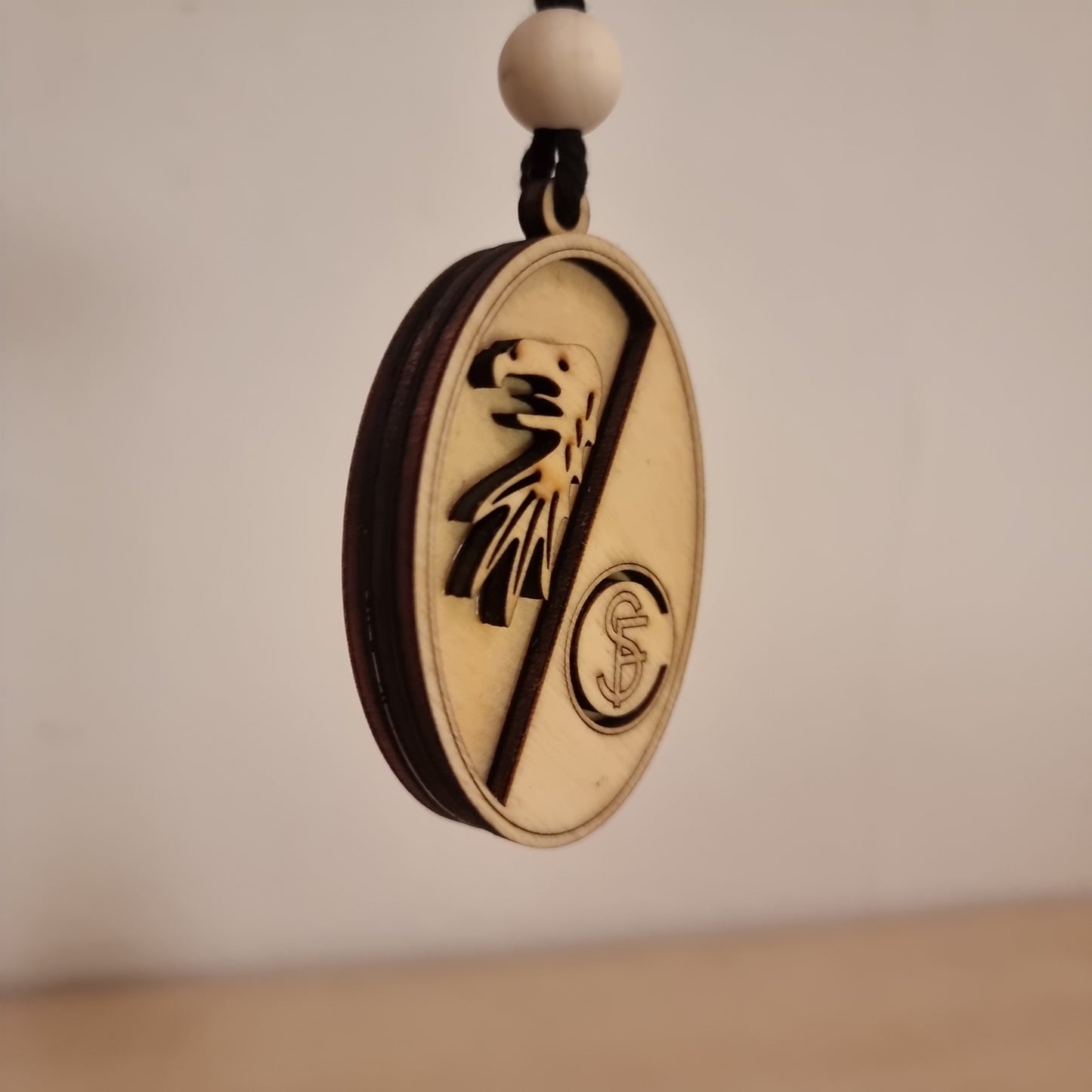 Freiburg FC pendant in wood with 3D effect