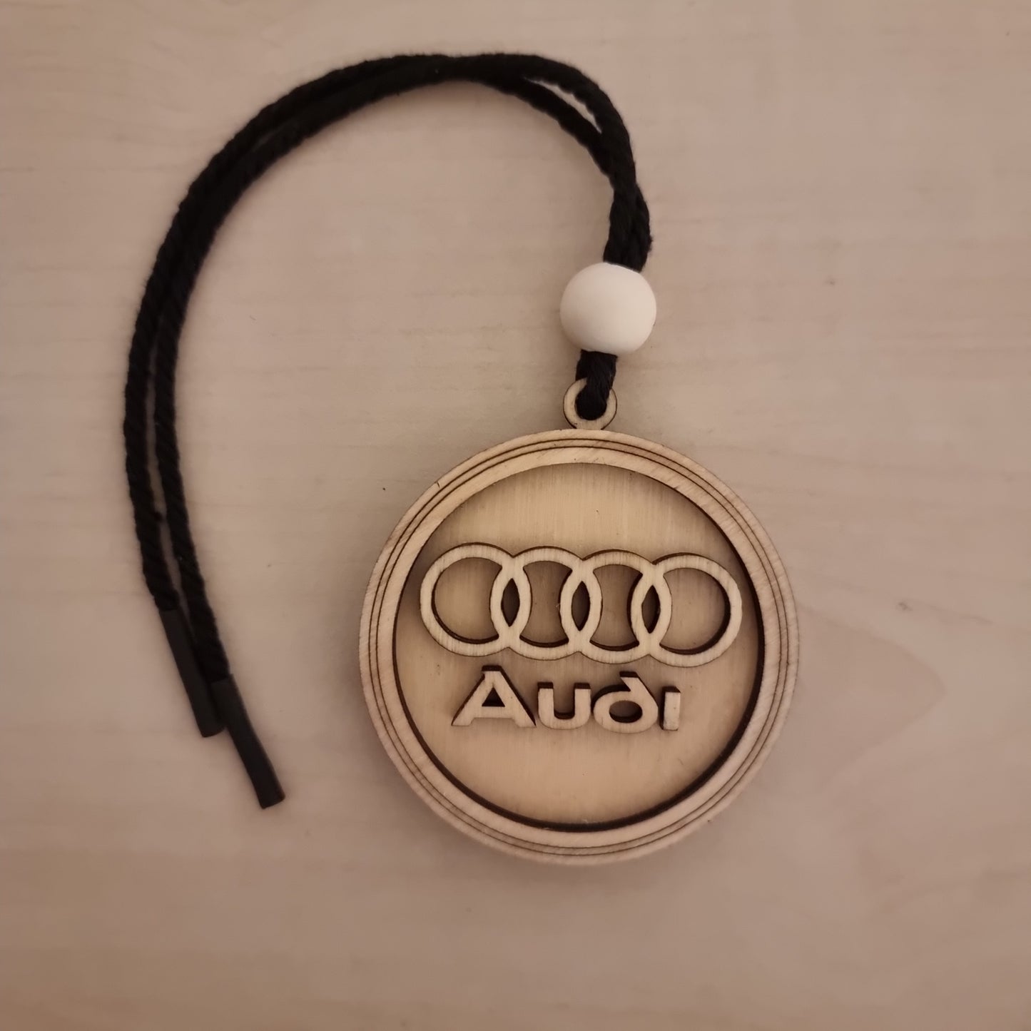 Audi pendant in wood with 3D effect