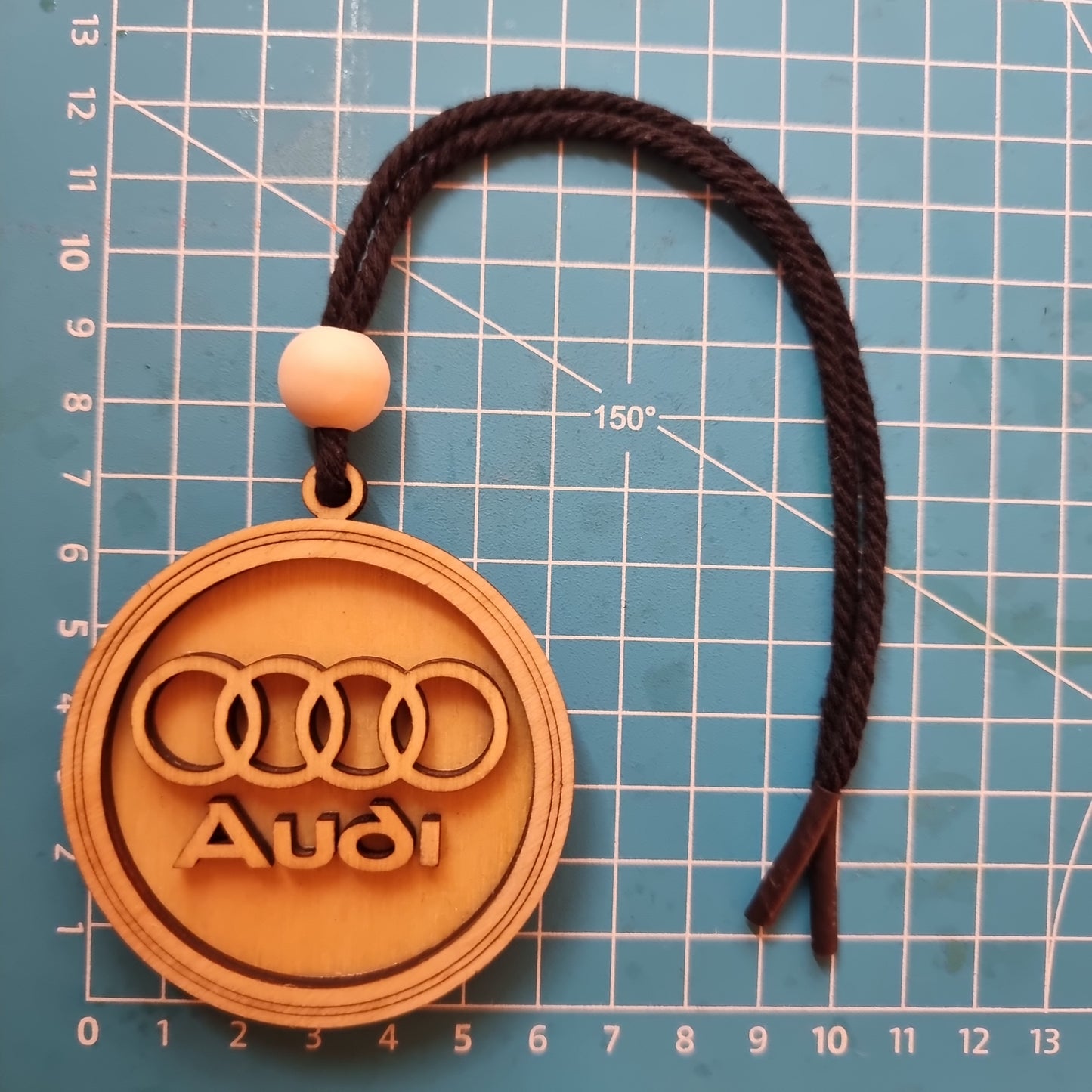 Audi pendant in wood with 3D effect